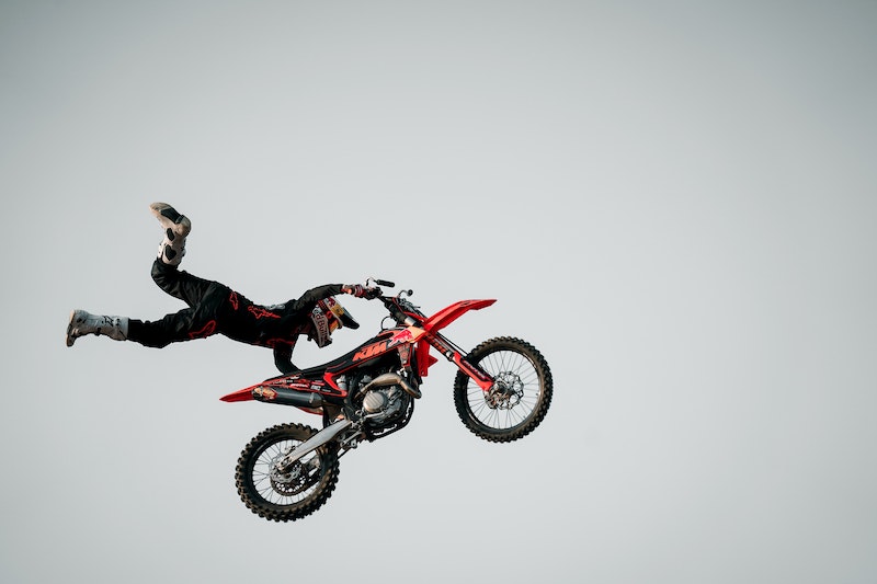 Motorcyclist in the air doing a stunt Motorcyclist in the air doing a stunt